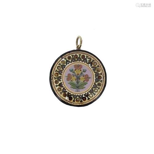 Circular pendant patterned with a polychrome ename…