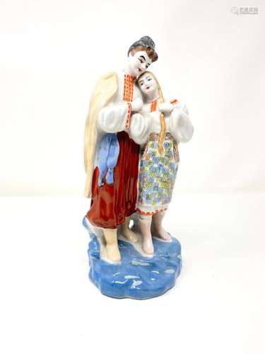 Polychrome porcelain group depicting two lovers in…