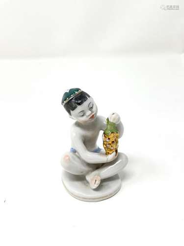 Polychrome porcelain figure with gold highlights s…