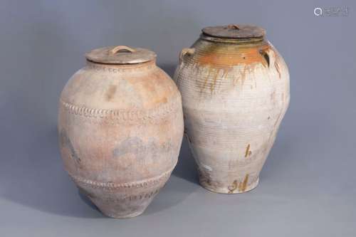 Two large Spanish or French earthenware olive jars...