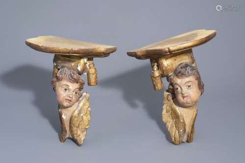 A pair of German polychrome painted and gilt woode...