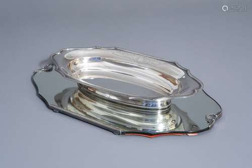 A Ghent silver charger on a glass stand, Sauvage F...