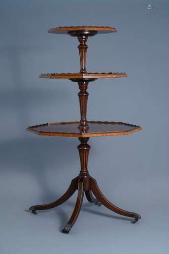 An octagonal English mahogany three tier dumbwaite...