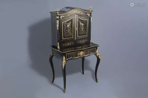 A French ebonised wooden brass inlaid and gilt bro...