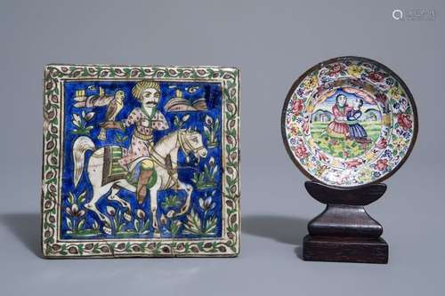 A tile with a falconer and an enamel saucer, Qajar...