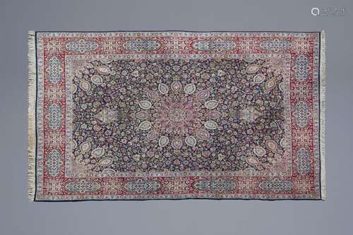 A fine Oriental rug with floral design, wool on co...