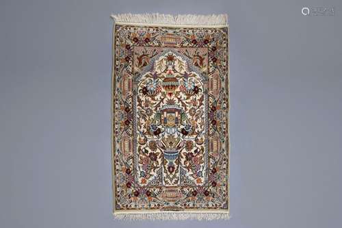 An Oriental prayer rug with birds, antiquities and...