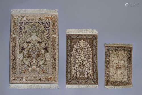 Three Oriental rugs with floral design and animals...