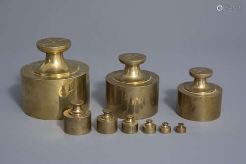 A French nine piece set of copper bank weights for...