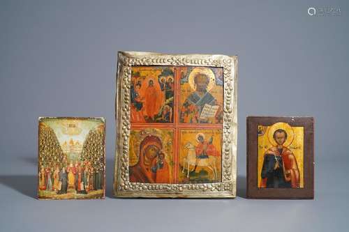 Three Russian icons, one with copper oklad or riza...