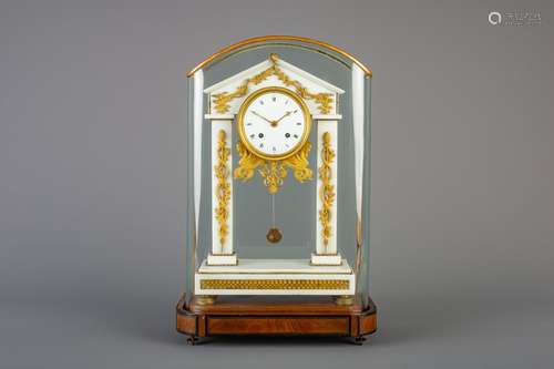 A French white marble and gilt bronze portico cloc...