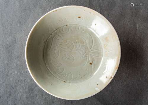 A Chinese Carved Ding Kiln Porcelain Plate