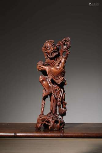 A Chinese Carved Longan Wood Ornament of Immortal Li Tieh-Kuai