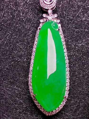 A Chinese Carved Jadeite Pendant