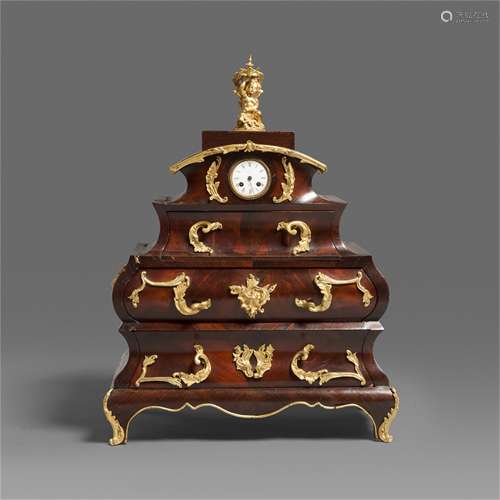 A Carved Hardwood Clock with Gilt Bronze Inlaided