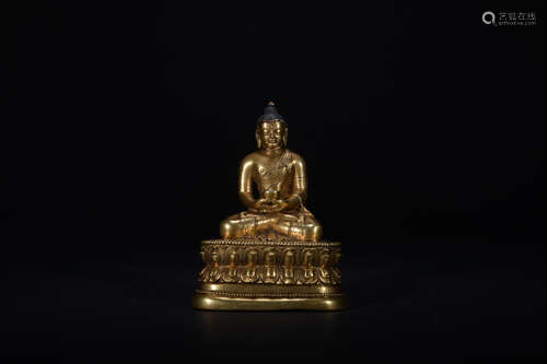 The 15th century gilt bronze statue of Buddha Shakyamuni