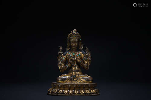 The 15th century gilt bronze sitting statue of Buddha