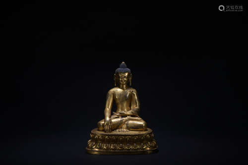 The 14th century gilt bronze sitting statue of shakyamuni