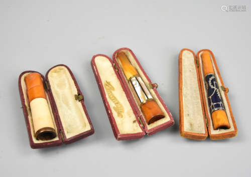 3 Amber Ciggarette Holder, one w/ MOP, 19th C.