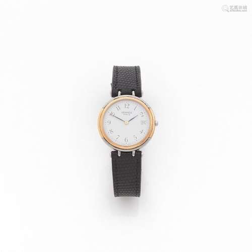 HERMES Montre bracelet en acier et métal doré sur …