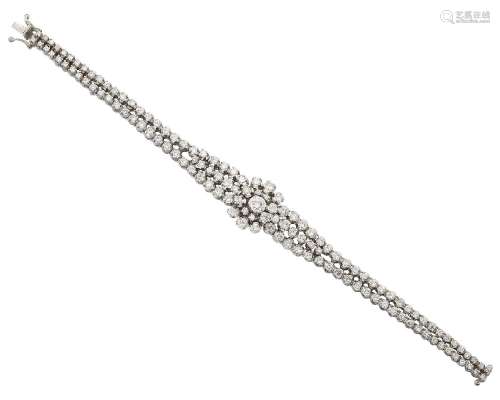 A diamond bracelet, the central cluster with triple row shoulders and twin line bracelet, set