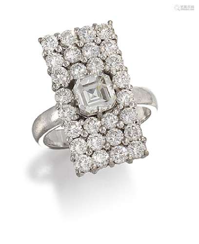 A diamond rectangular panel cluster ring, the central cut-cornered square diamond claw-set within