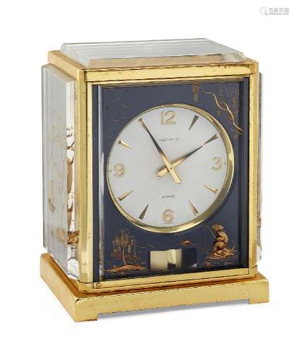 A gilt-brass and plexiglass Atmos 'Marina' clock by Jaeger-leCoultre, the circular dial with applied