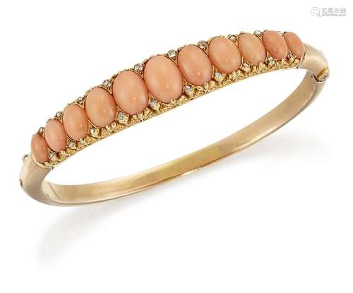 An Edwardian gold, coral and rose-cut diamond bangle, the hinged half-hoop set with a single row