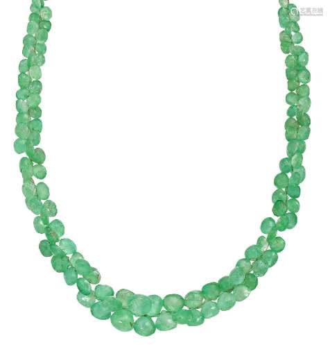 An emerald necklace, of torsade type, composed of a graduated single row of faceted pear shaped