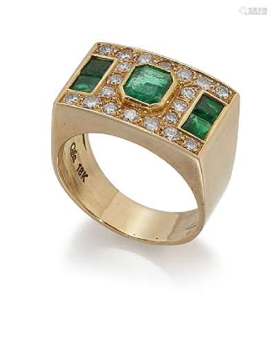 An emerald and diamond ring, the rectangular panel front with cut-cornered rectangular emerald