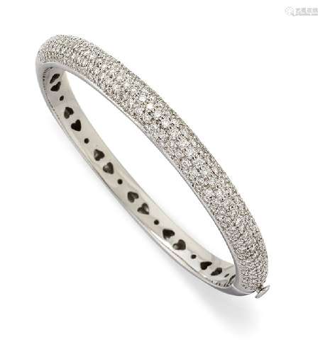 A diamond bangle, the upper half pave-set with brilliant-cut diamonds, the inner circumference