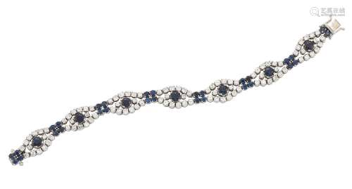 A diamond and sapphire bracelet, composed of a series of circular-cut sapphire and diamond