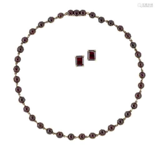 A 19th century garnet necklace, composed of a line of closed-set circular cabochon garnets,