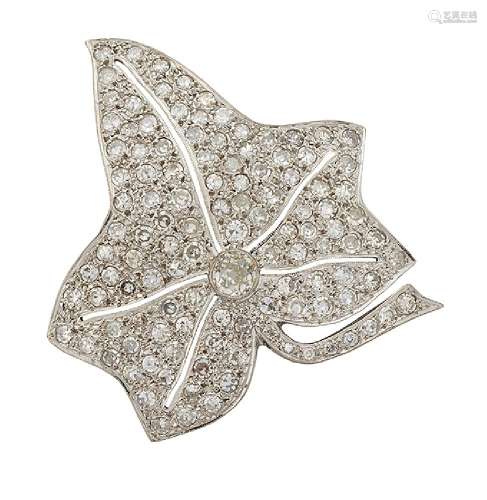 A diamond brooch, modelled as a pave single-cut diamond leaf with single old brilliant-cut diamond