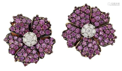 A pair of pink sapphire and diamond flowerhead cluster earclips, the brilliant-cut diamond bombé