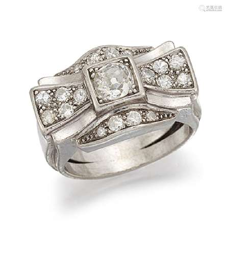 A 1940's diamond cluster ring, designed as a stylised bow, the old brilliant-cut diamond centre