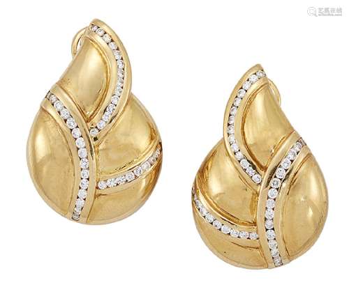 A pair of diamond earrings, each designed as a stylised leaf channel-set with arcs of brilliant-