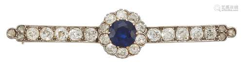 An early 20th century sapphire and diamond bar brooch, the central circular-cut sapphire and old