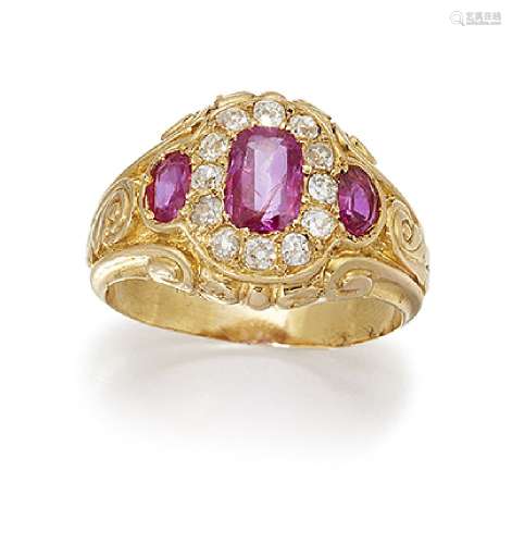 A ruby and diamond cluster ring, the central cushion shaped ruby within an old-cut diamond