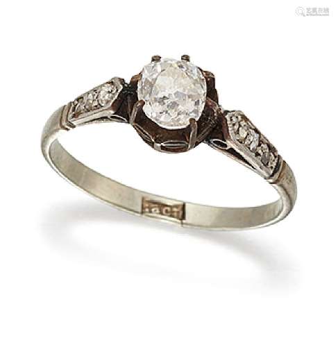 An old-cut diamond single stone ring, the central diamond claw-set in an openwork mount to diamond