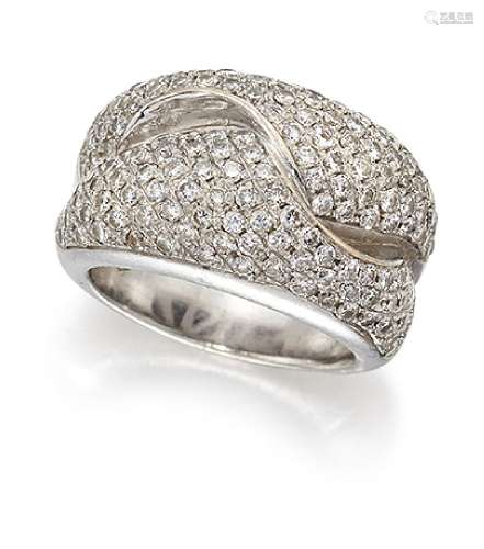 A pave diamond wave design ring, the interlocking folds of pave-set brilliant-cut diamonds