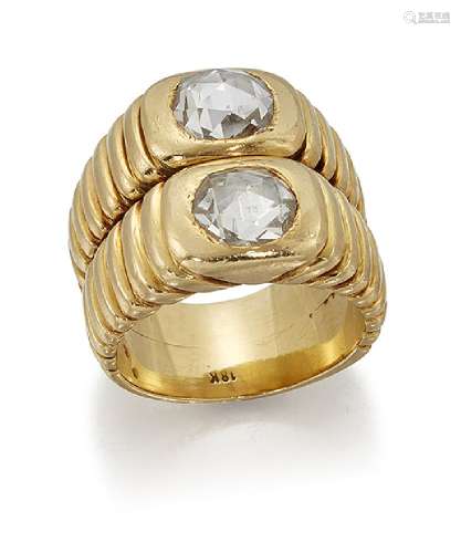 A rose cut diamond two stone ring, of twin tapered band design, each rose-cut diamond to reeded
