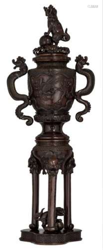 A large Oriental tripod incense burner, relief dec…