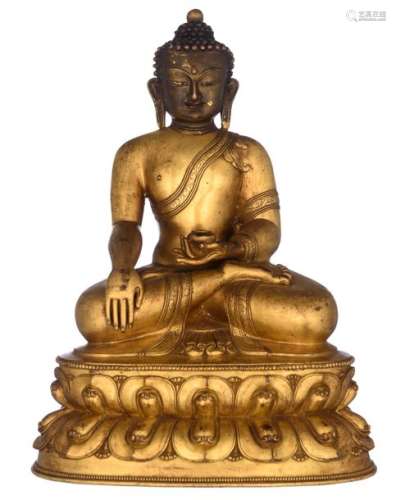 A Chinese bronze and gilt bronze seated Buddha, on…