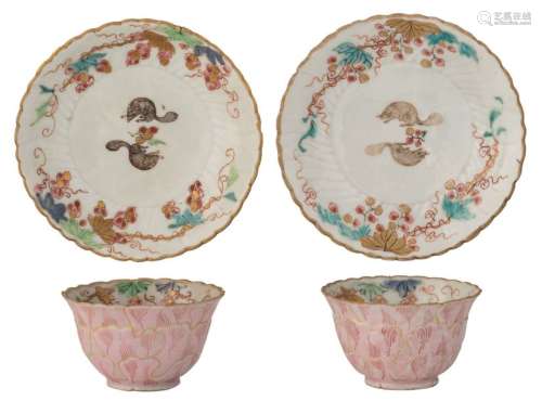 A pair of Chinese relief famille rose and gilt cup…