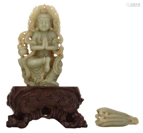 An Oriental jade carved meditating figure in tree …
