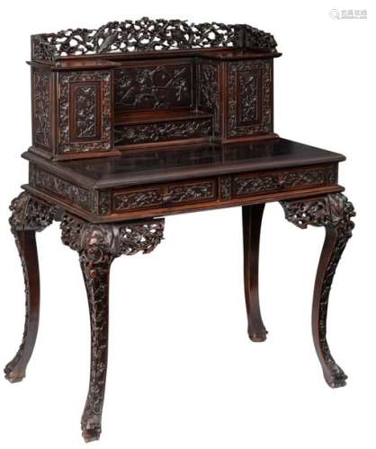 A Chinese exotic hardwood writing desk, richly scu…