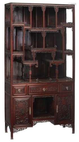 A fine Chinese rosewood display cabinet, decorated…