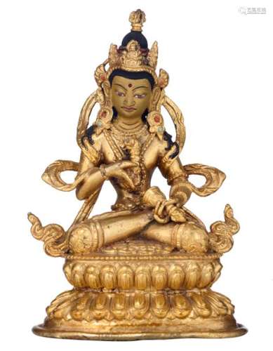 A Sino Tibetan gilt bronze seated Buddha on a ditt…
