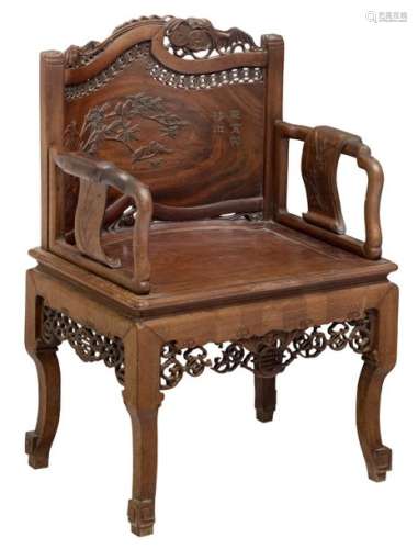 A Chinese inspired richly sculpted hardwood armcha…